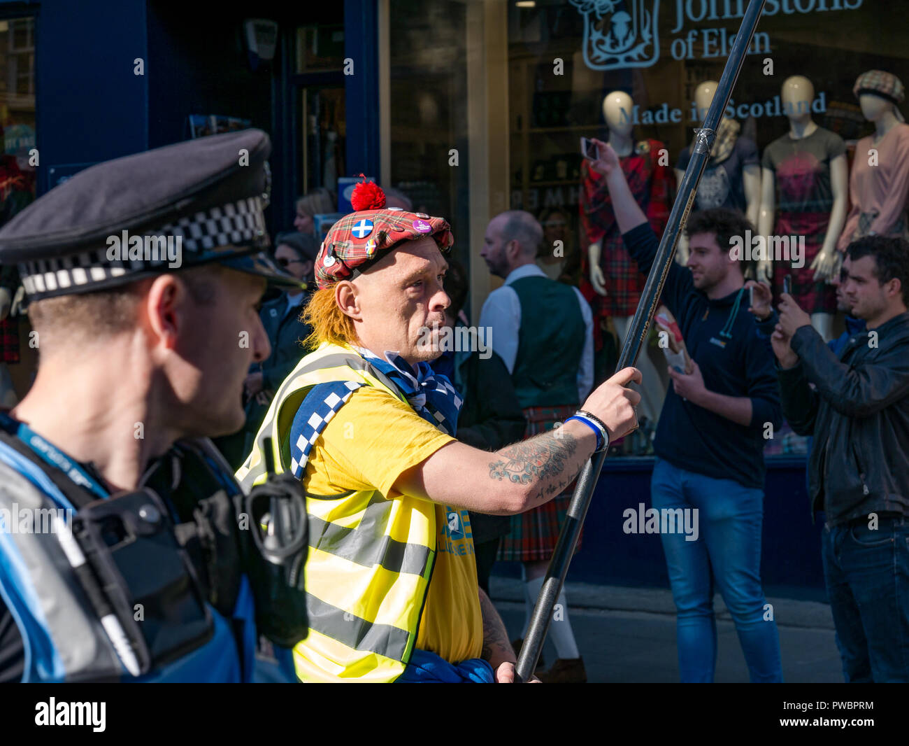 Gary Kelly in see you Jimmy hat leading All Under One Banner Scottish Independence march 2018 with police escort, Royal Mile, Edinburgh, Scotland, UK Stock Photo