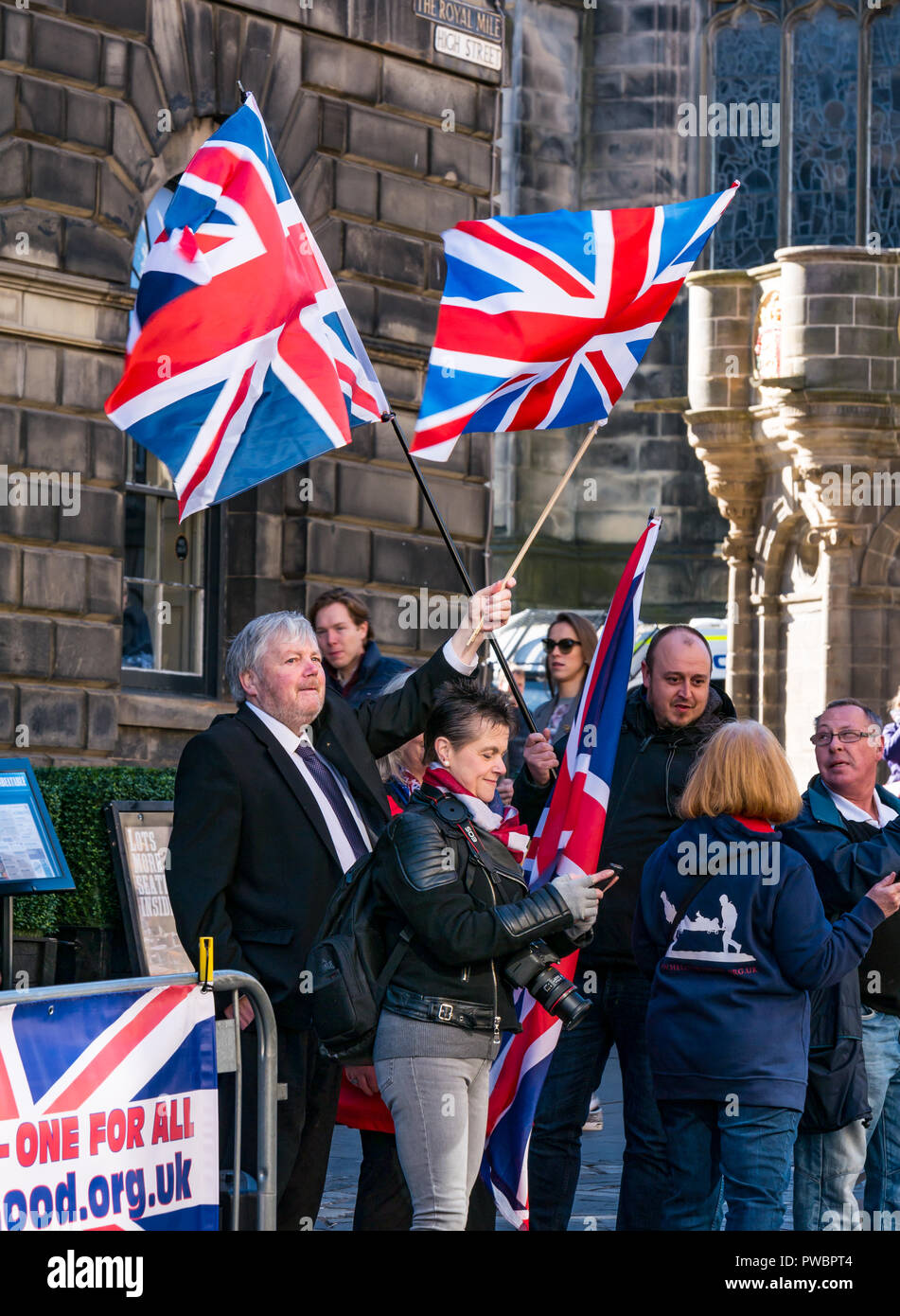 Pro Union supporters waving Union Jack flags at Scottish Independence All Under One Banner AUOB march 2108, Royal Mile, Edinburgh, Scotland, UK Stock Photo