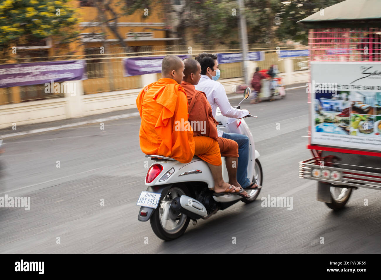 Monks on a scooter in Cambodia Stock Photo