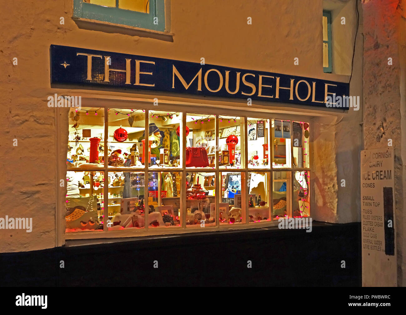 the mousehole, village shop decorated at christmas time, mousehole, cornwall, england, britain, uk. Stock Photo