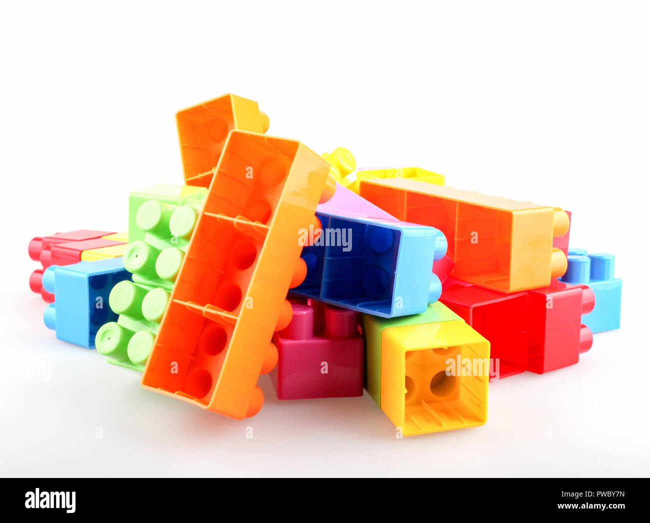 Plastic colorful toy blocks on white background Stock Photo - Alamy