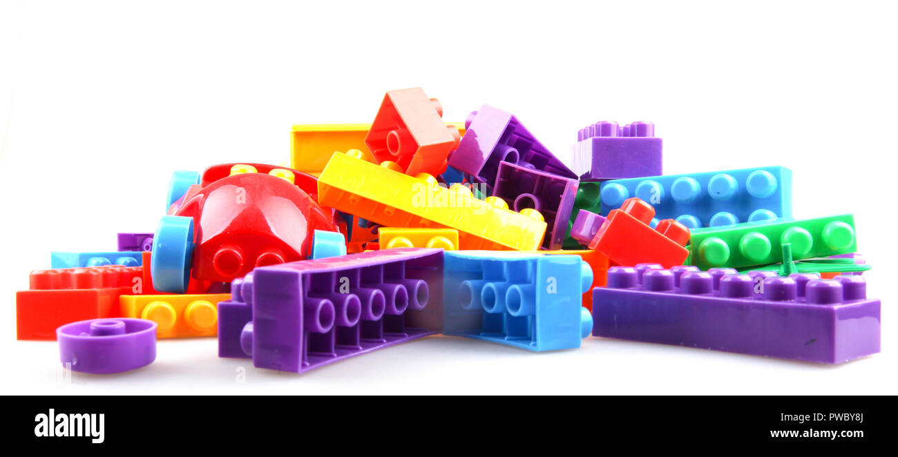 Plastic colorful toy blocks on white background Stock Photo - Alamy