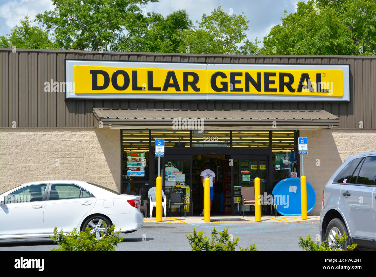 Store front entrance from parking lot of a rural Dollar General store near Apalachicola, FL, USA ...