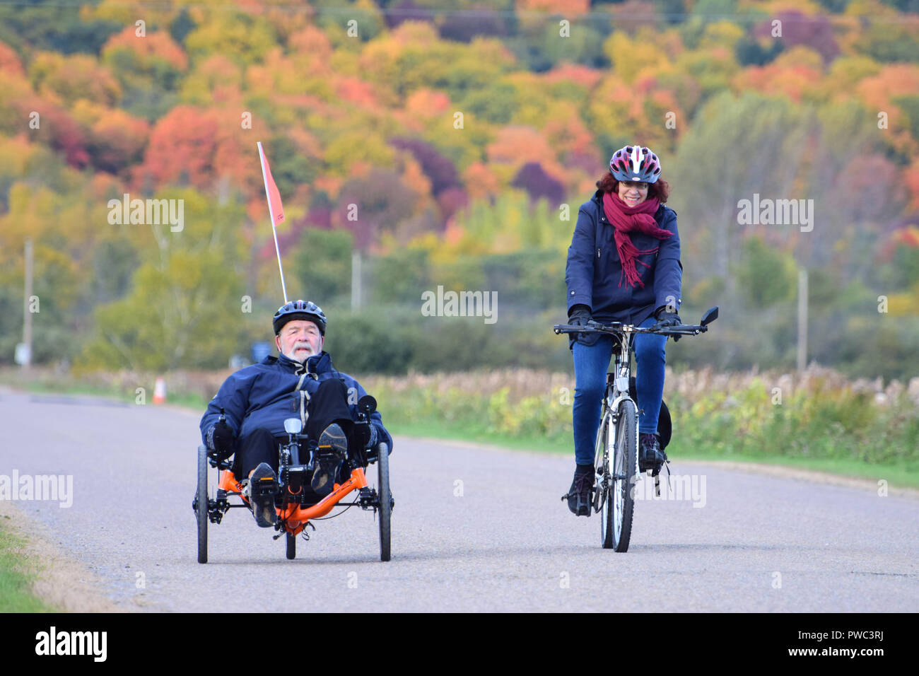 Active senior men riding a tricycle Stock Photo Alamy