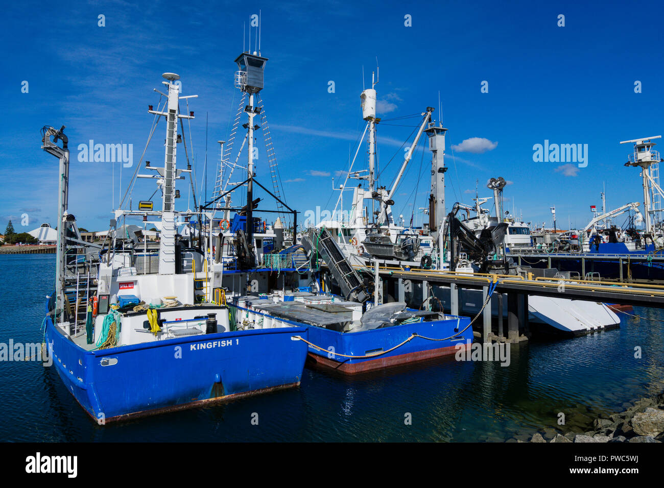 Tuna and fishing trawlers tied up at wharf in Port Lincoln South Australia Stock Photo