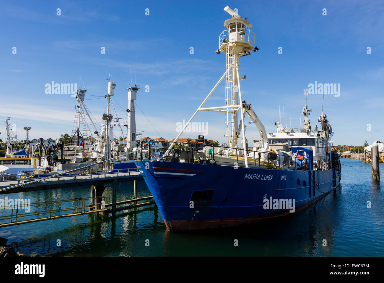 Tuna and fishing trawlers tied up at wharf in Port Lincoln South Australia Stock Photo