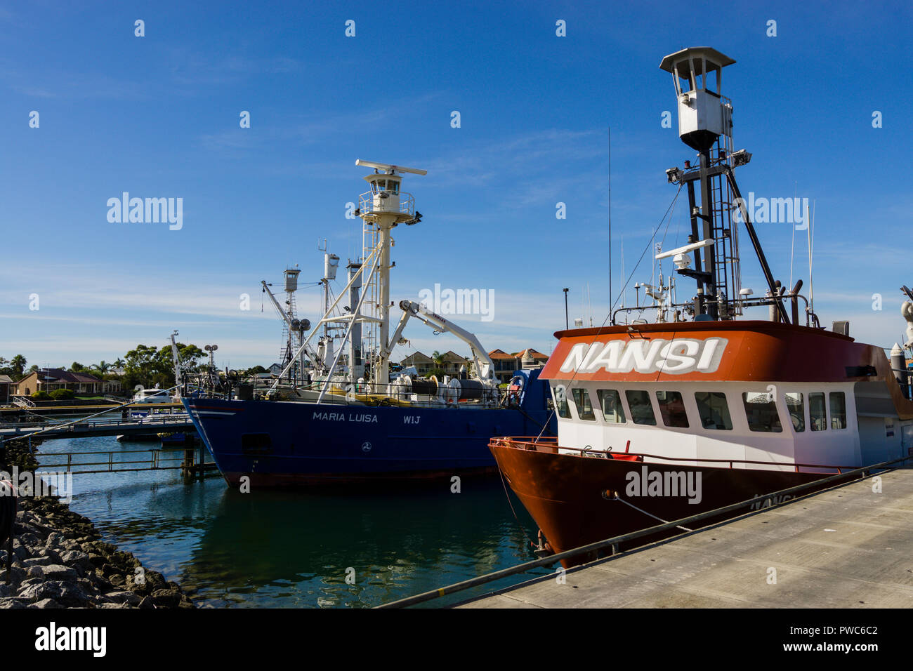 Tuna and fishing trawlers tied up at wharf in Port Lincoln South Australia Stock Photo