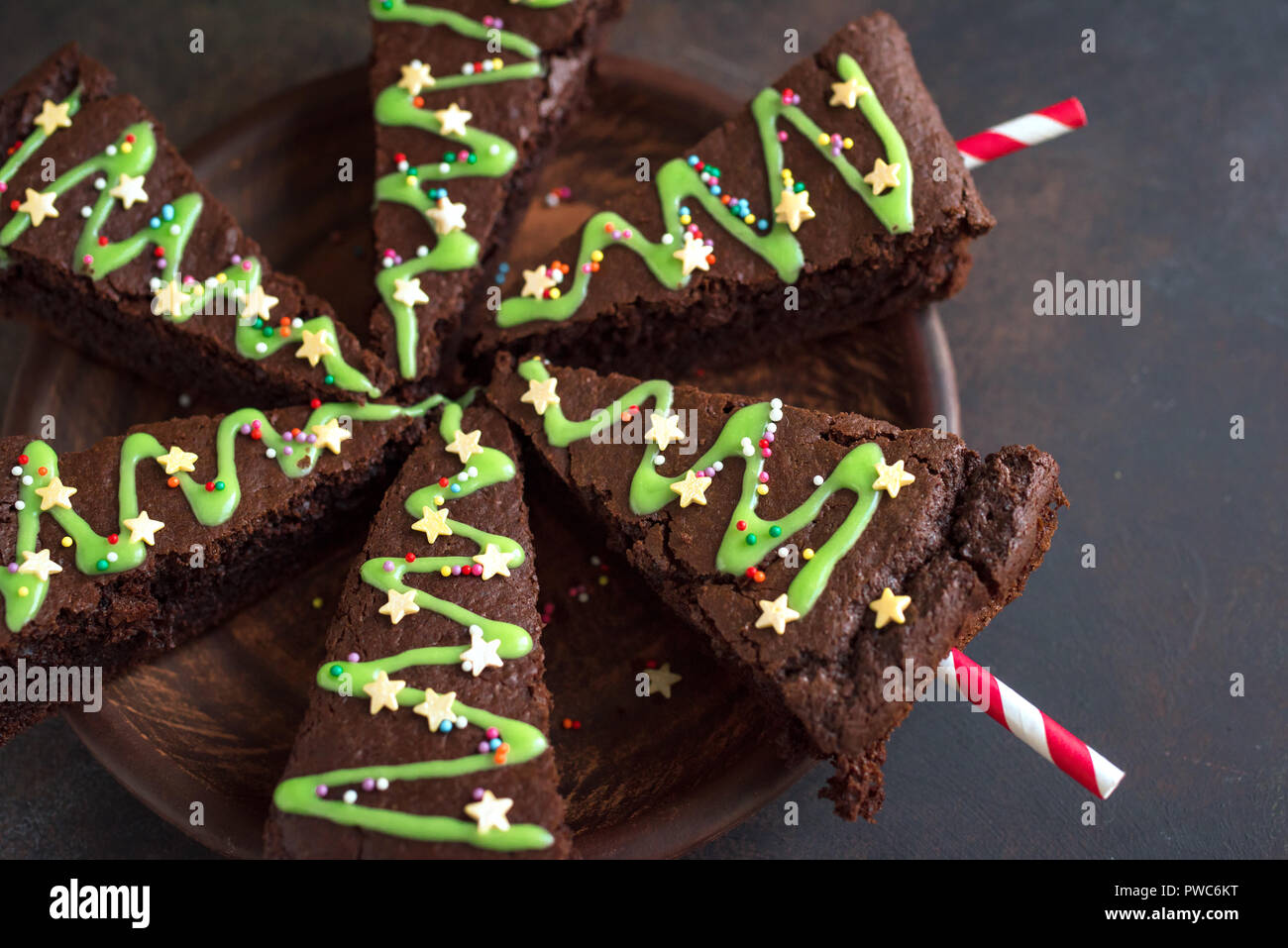 Chocolate Brownie In Shape Of Christmas Tree With Green Icing And