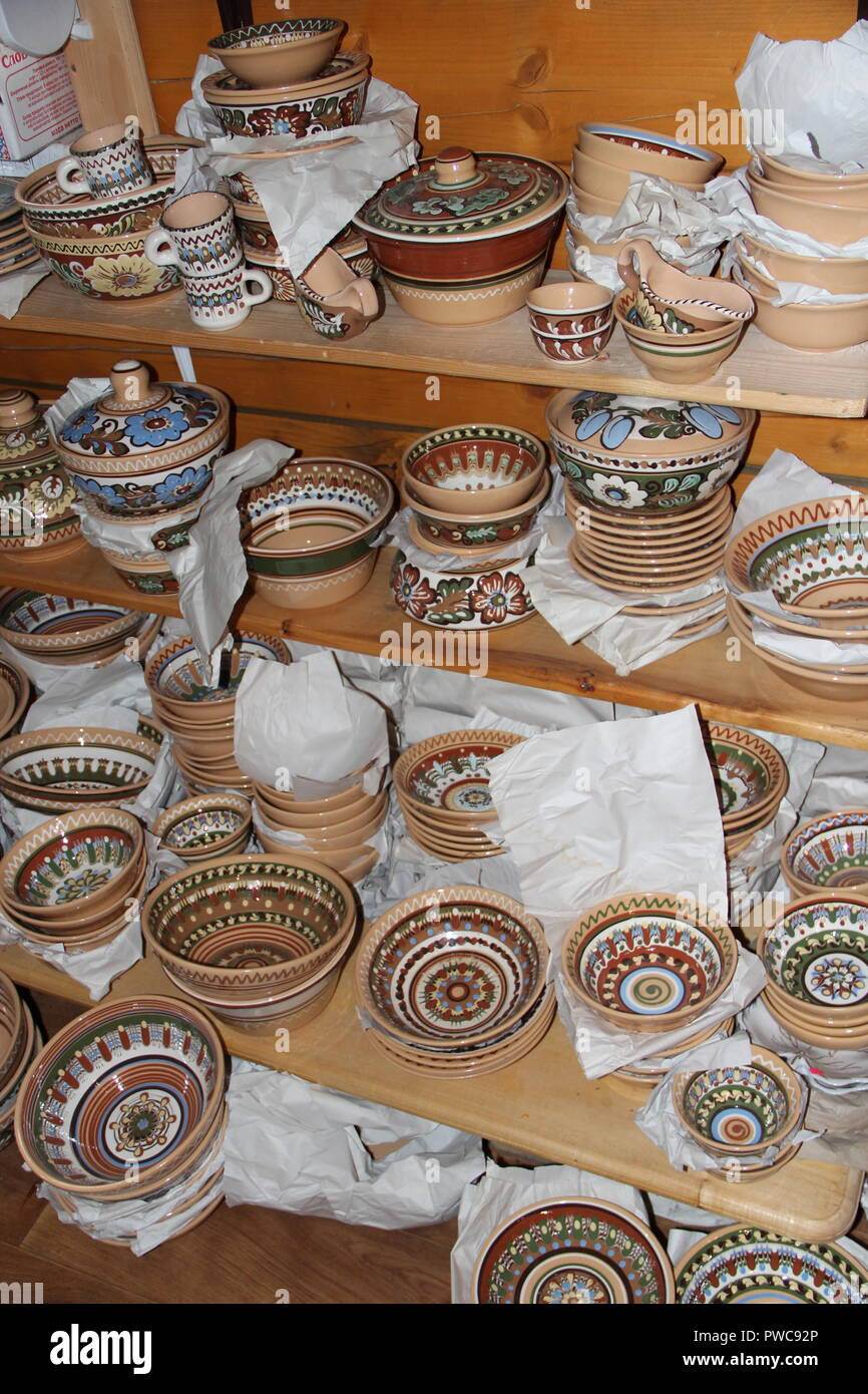 A wide choice of ceramic products on the shelf of the store. Pottery for sale.Ceramic goods. Products of ceramics on sale. Ceramic crockery Stock Photo