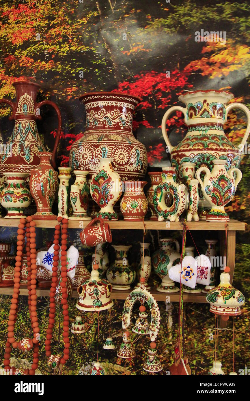 A wide choice of ceramic products on the shelf of the store. Pottery for sale.Ceramic goods. Products of ceramics on sale. Ceramic crockery in shop Stock Photo