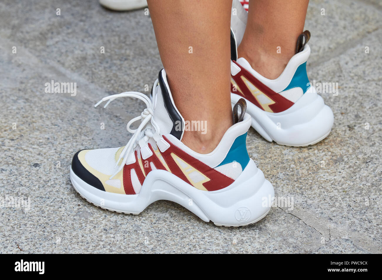 MILAN, ITALY - SEPTEMBER 20, 2018: Woman with Louis Vuitton white, red,  blue and yellow sneakers before Max Mara fashion show, Milan Fashion Week  stre Stock Photo - Alamy