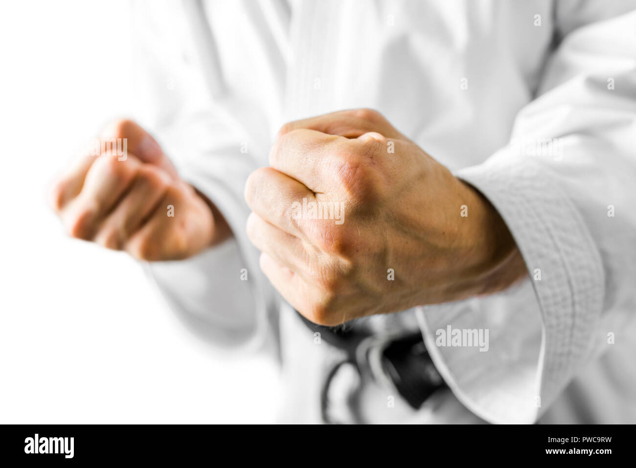 Fighter making a fist in the direction of the camera either as a belligerent combative gesture in anger or as a self motivational gesture after a succ Stock Photo