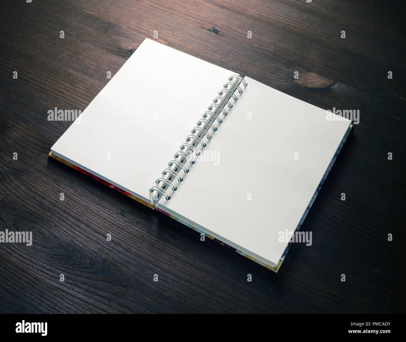 Blank notebook on wood table background. Spiral notepad. Mockup for ...