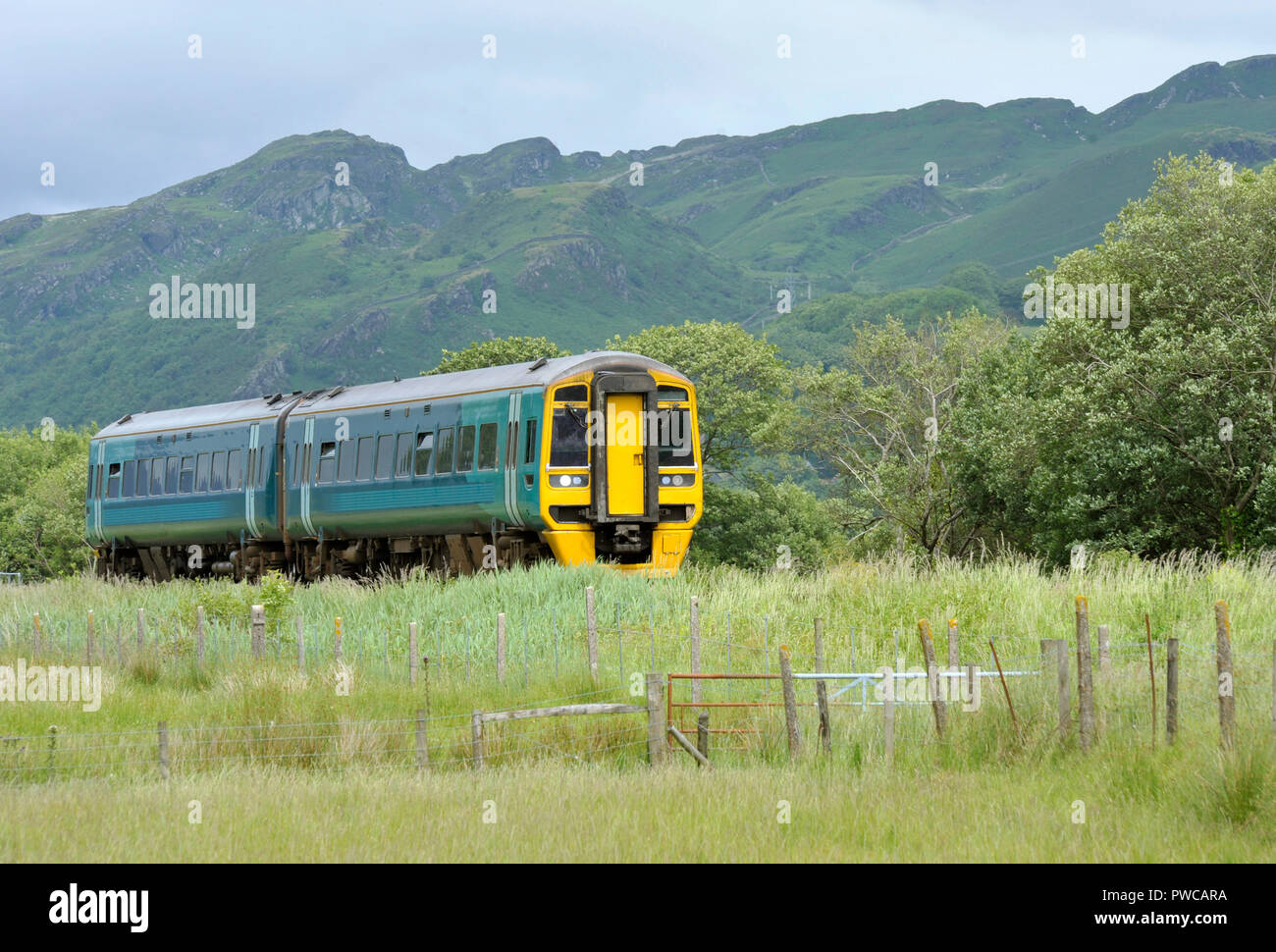 Railway diesel train locomotive in rural countryside at Talsarnau, Gwynedd in North Wales UK. Stock Photo