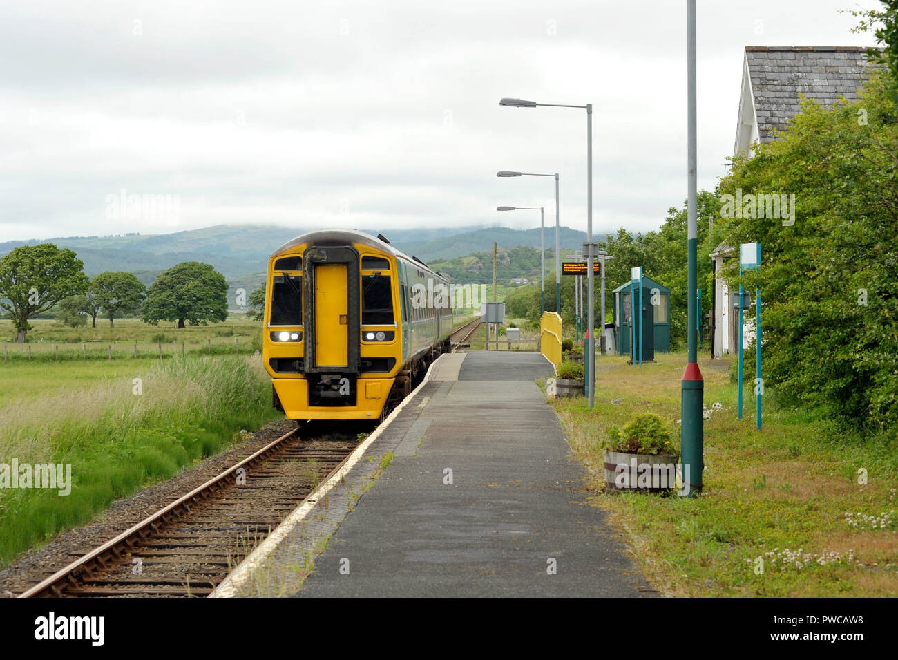 Railway diesel train locomotive at rural Talsarnau station, Gwynedd in North Wales UK. Stock Photo