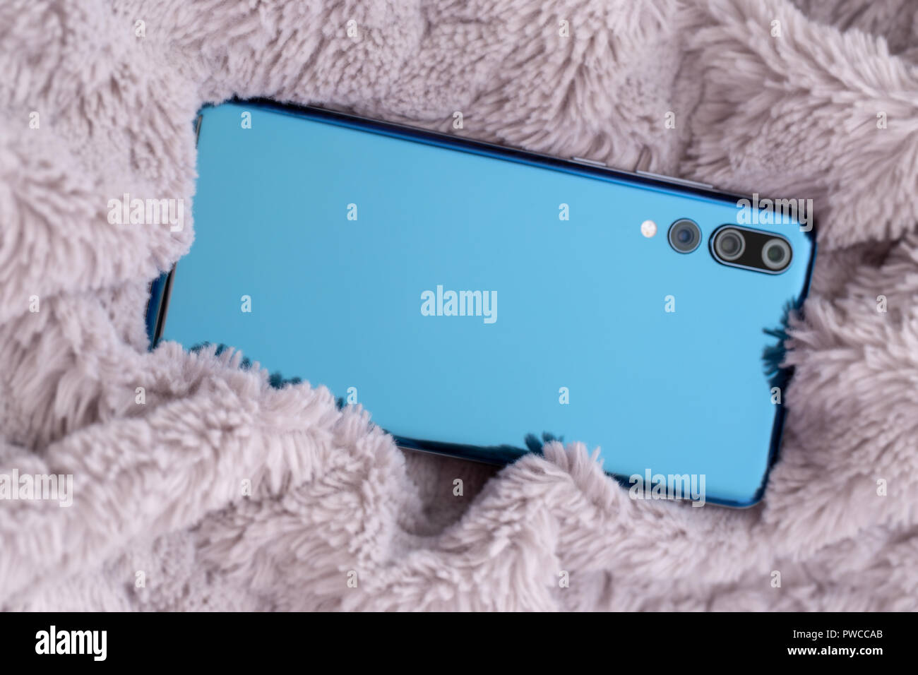 New design smartphone looks like Huawei P20 pro. Stock Photo