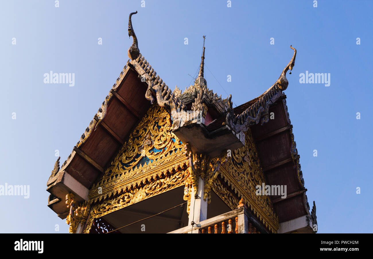 Fine-art roof top of a building at Wat Hua Wiang Tai temple, Nan, nothern of Thailand. Stock Photo