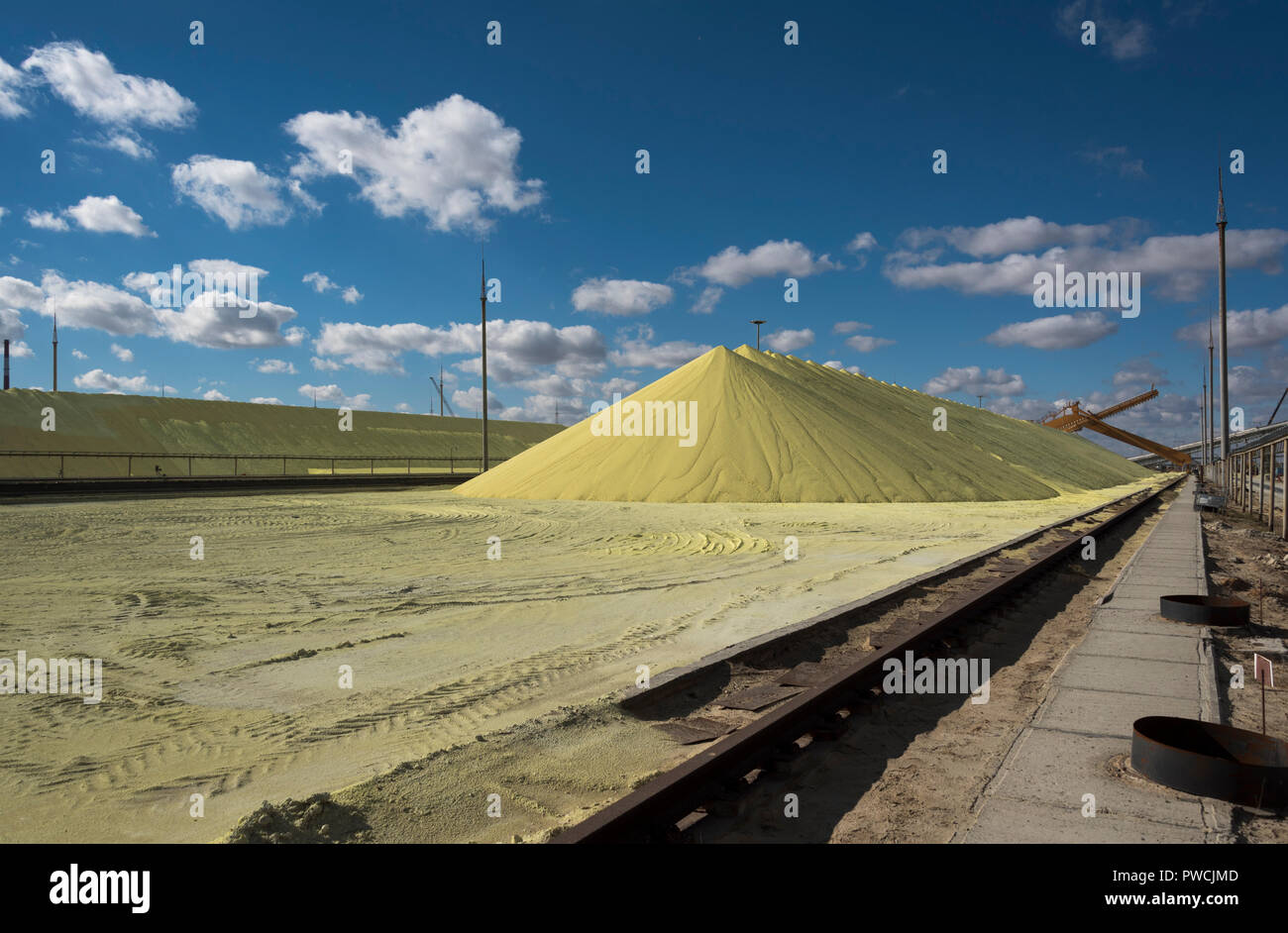Sulfur piles storage at the PAO Gazprom factory in Astrakhan, Russia. Stock Photo