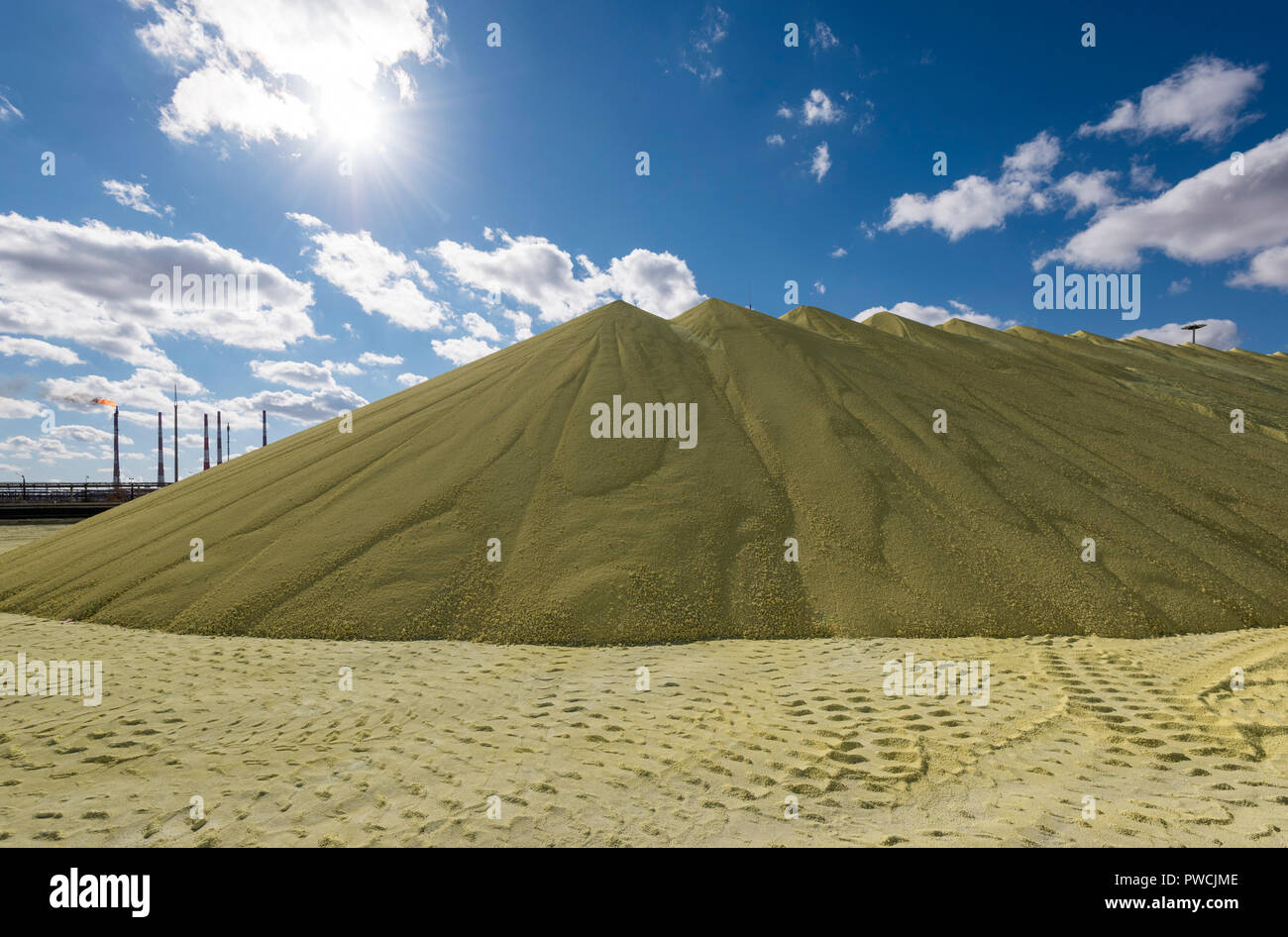 Sulfur piles storage at the PAO Gazprom factory in Astrakhan, Russia. Stock Photo