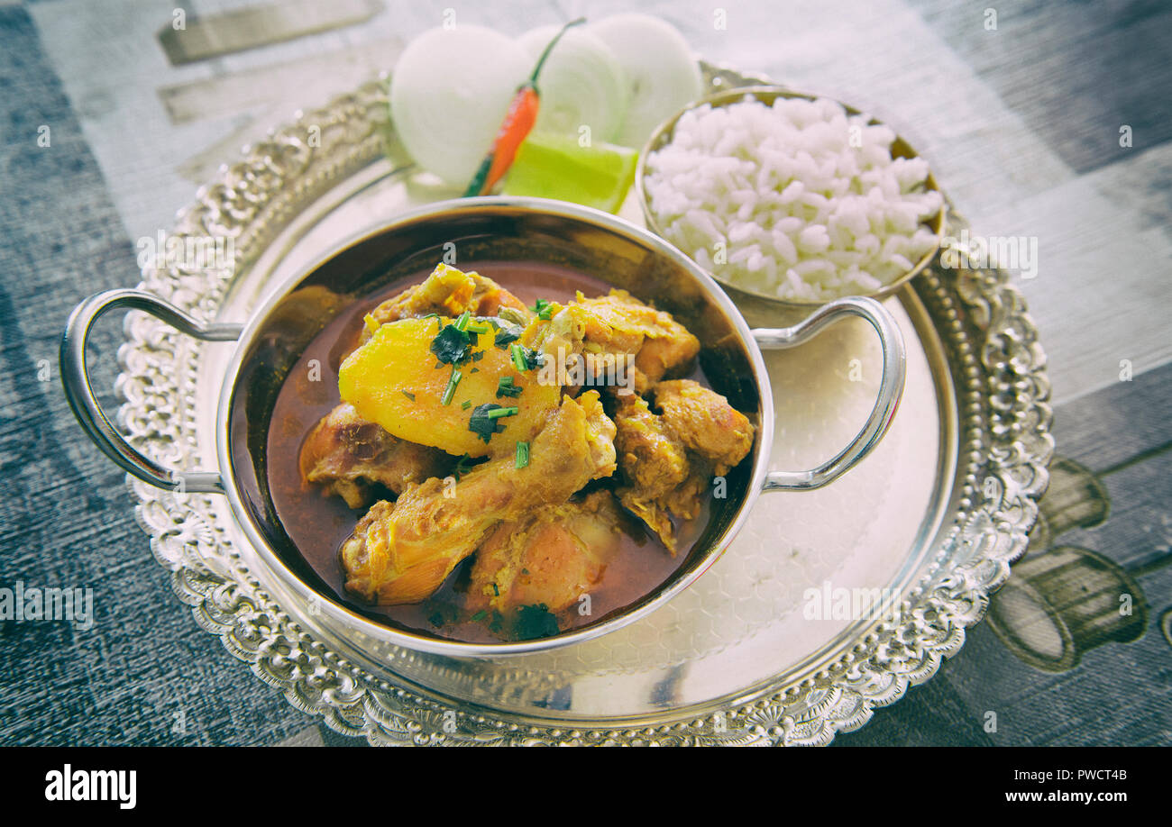 Spicy indian chicken curry with rice Stock Photo Alamy