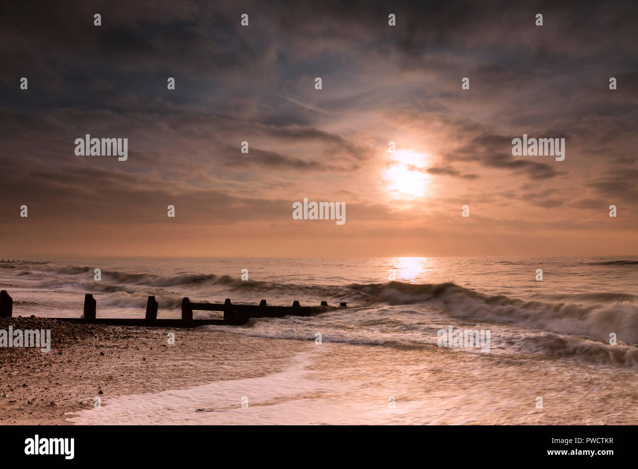 Coastal shoreline of Worthing at sunrise, Worthing, West Sussex Stock Photo