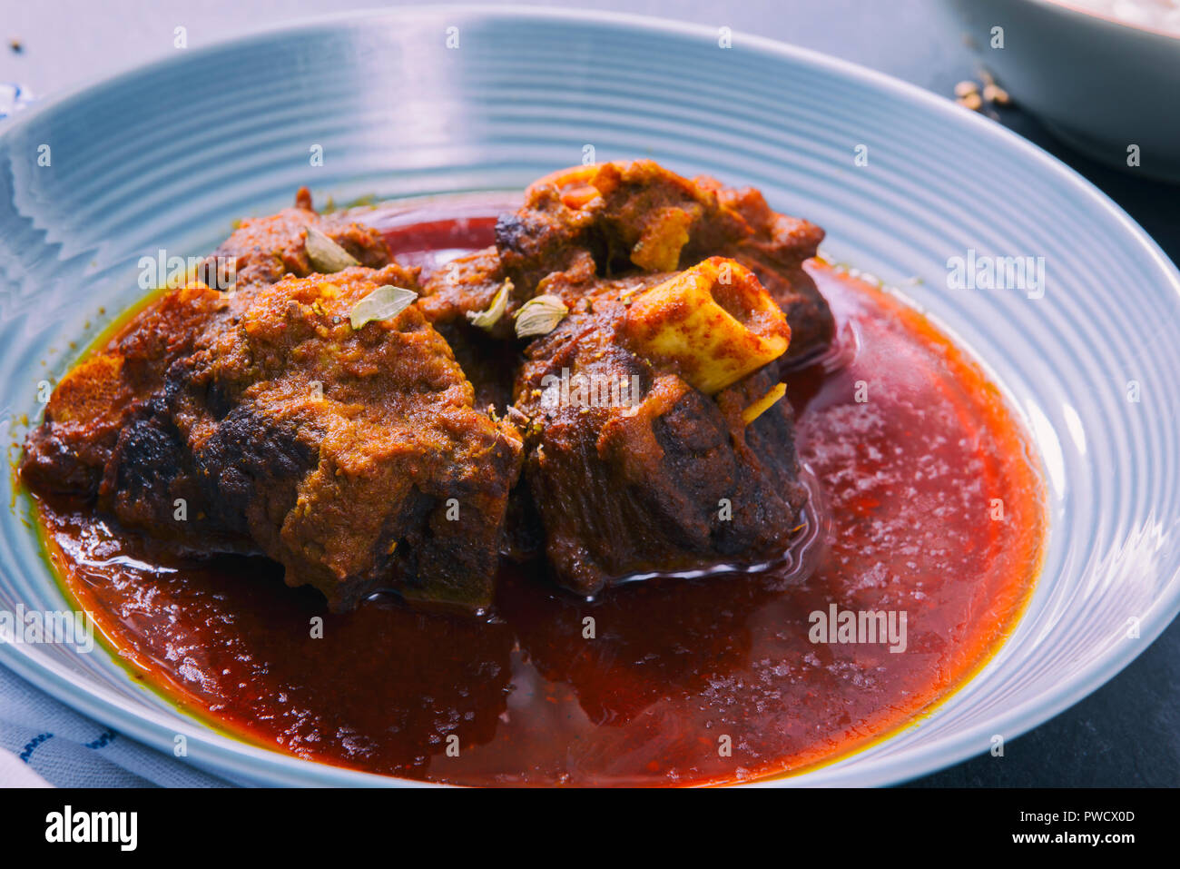 Indian goat meat curry with rice Stock Photo Alamy