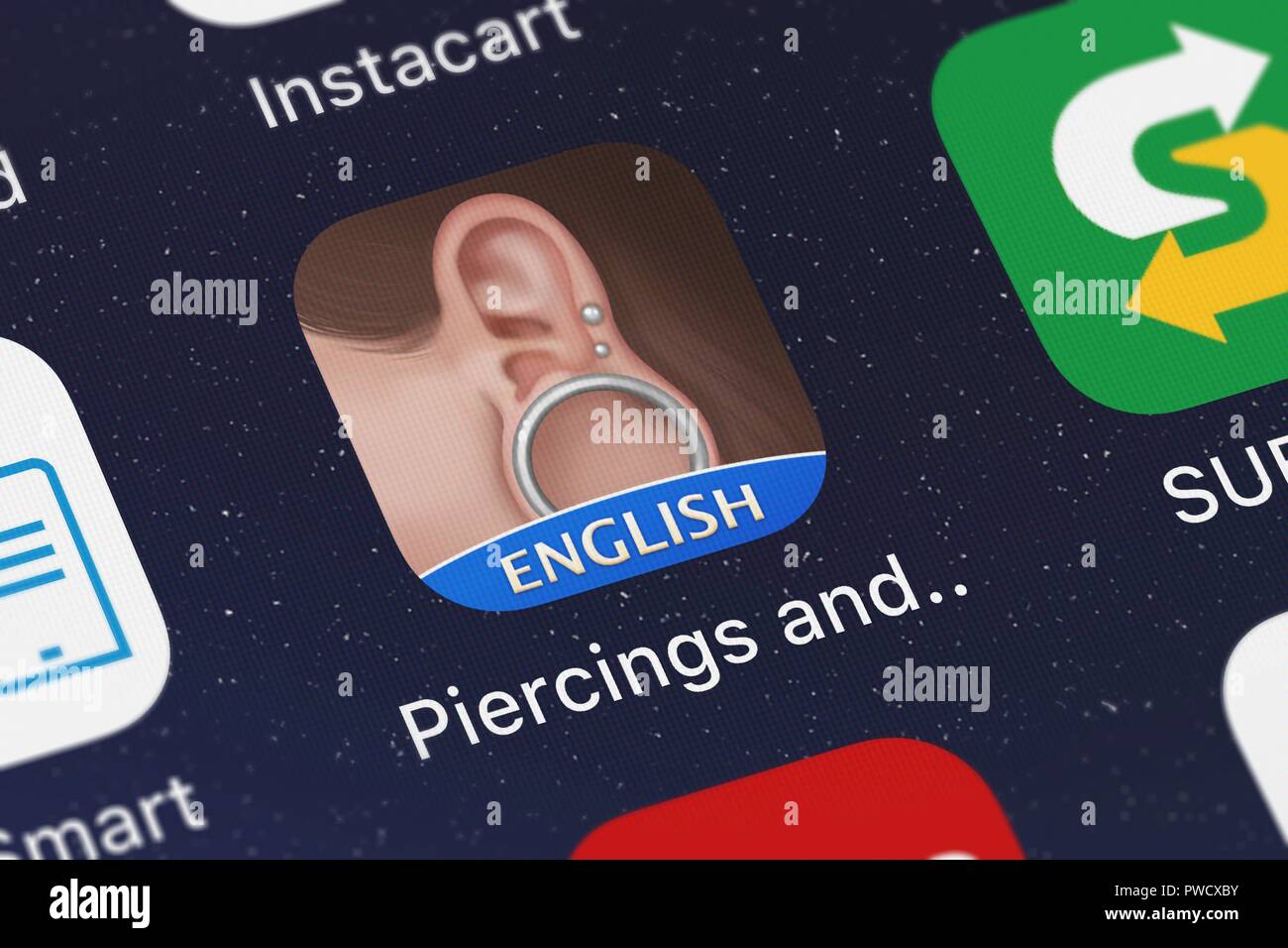 London, United Kingdom - October 15, 2018: Screenshot of the Piercings and Body Mod Amino mobile app from Narvii Inc. icon on an iPhone. Stock Photo