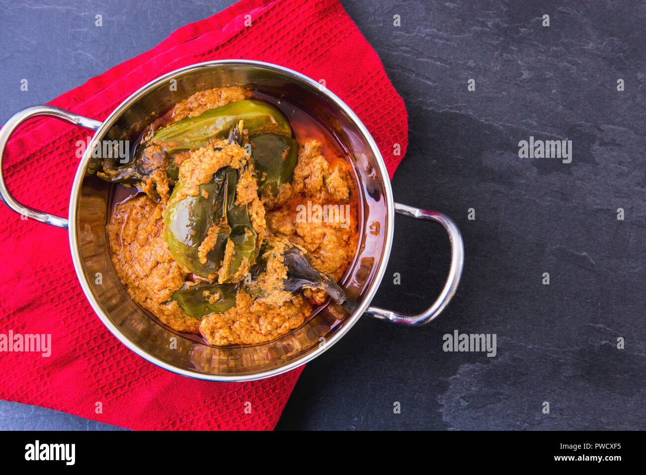 Indian Eggplant masala curry with Roti Stock Photo Alamy