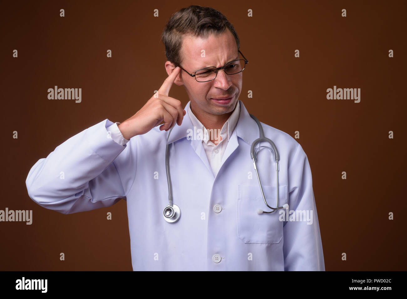 Studio portrait tired medical doctor hi-res stock photography and ...