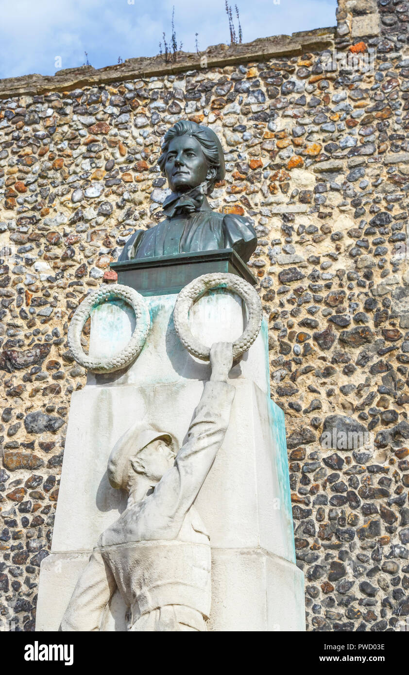 Memorial statue with head and shoulders bust of Edith Cavell, nurse, patriot and martyr by Norwich Cathedral, Norfolk, East Anglia, eastern England Stock Photo