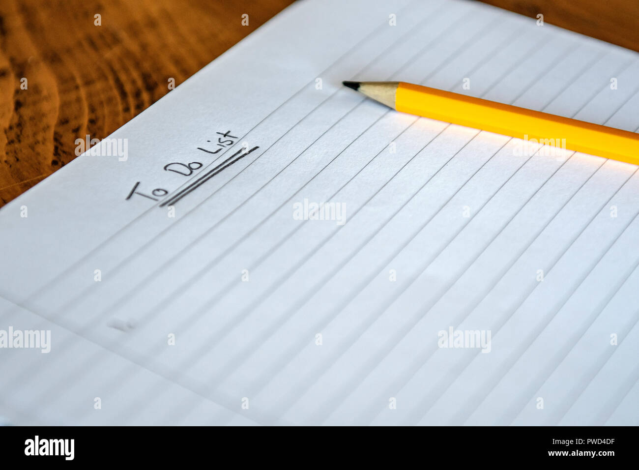 Pencil and Paper. Blank note pad awaiting ideas Stock Photo
