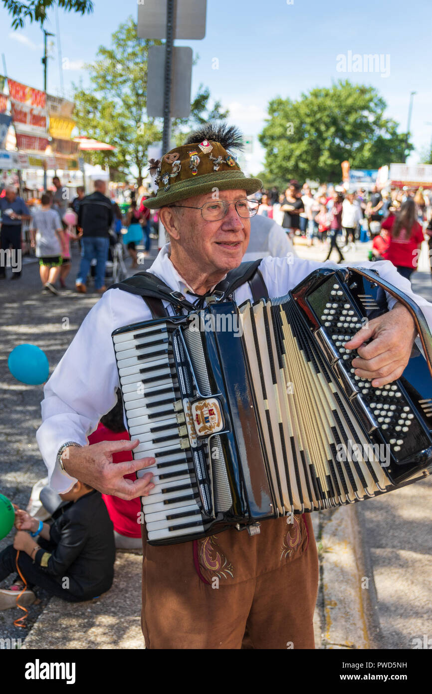 HICKORY, NC, USA-10/14/18:  Closeup of An accordion player roams the crowd and entertains wearing traditional Scandinavian garb. Stock Photo