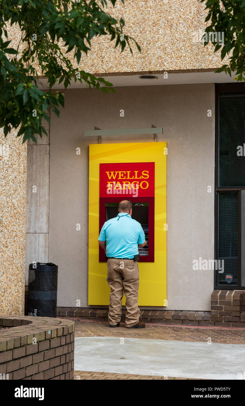 HICKORY, NC, USA-10/14/18: A man uses a Wells Fargo ATM. Stock Photo