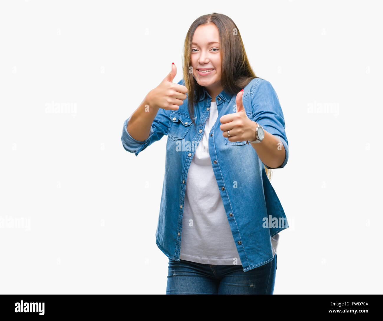 Young caucasian beautiful woman over isolated background approving ...