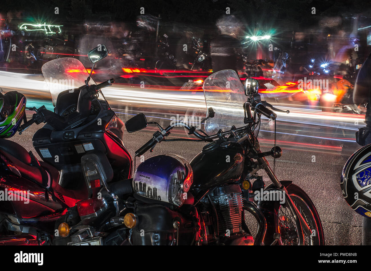 Atractive moto meeting. Many motocycle, fast speed, smoke and noise. Red  and white lights. Hign adrenaline Stock Photo - Alamy