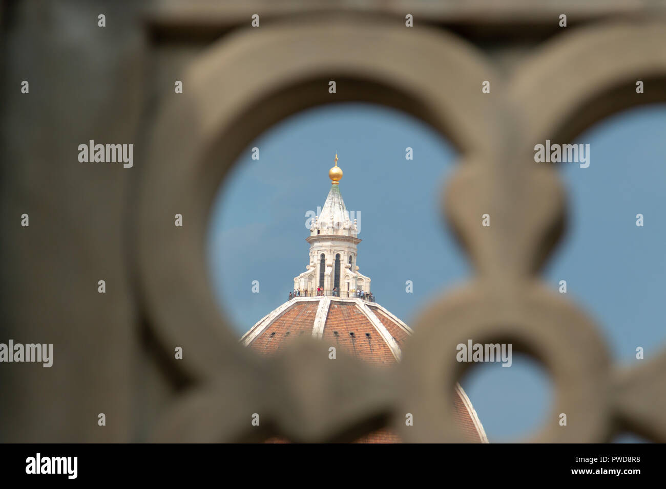 The tip of the Duomo as seen through a wall at the outdoor cafe of the Uffizi Gallery, Florence, Italy. Stock Photo