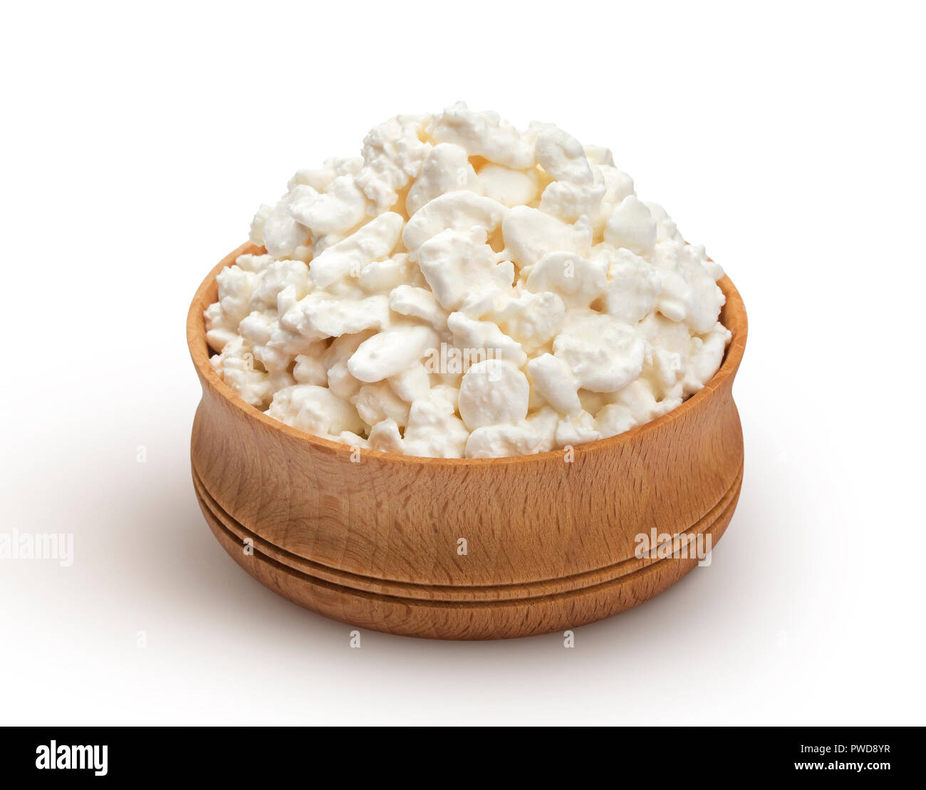 Cottage cheese in wooden bowl isolated on white background Stock Photo