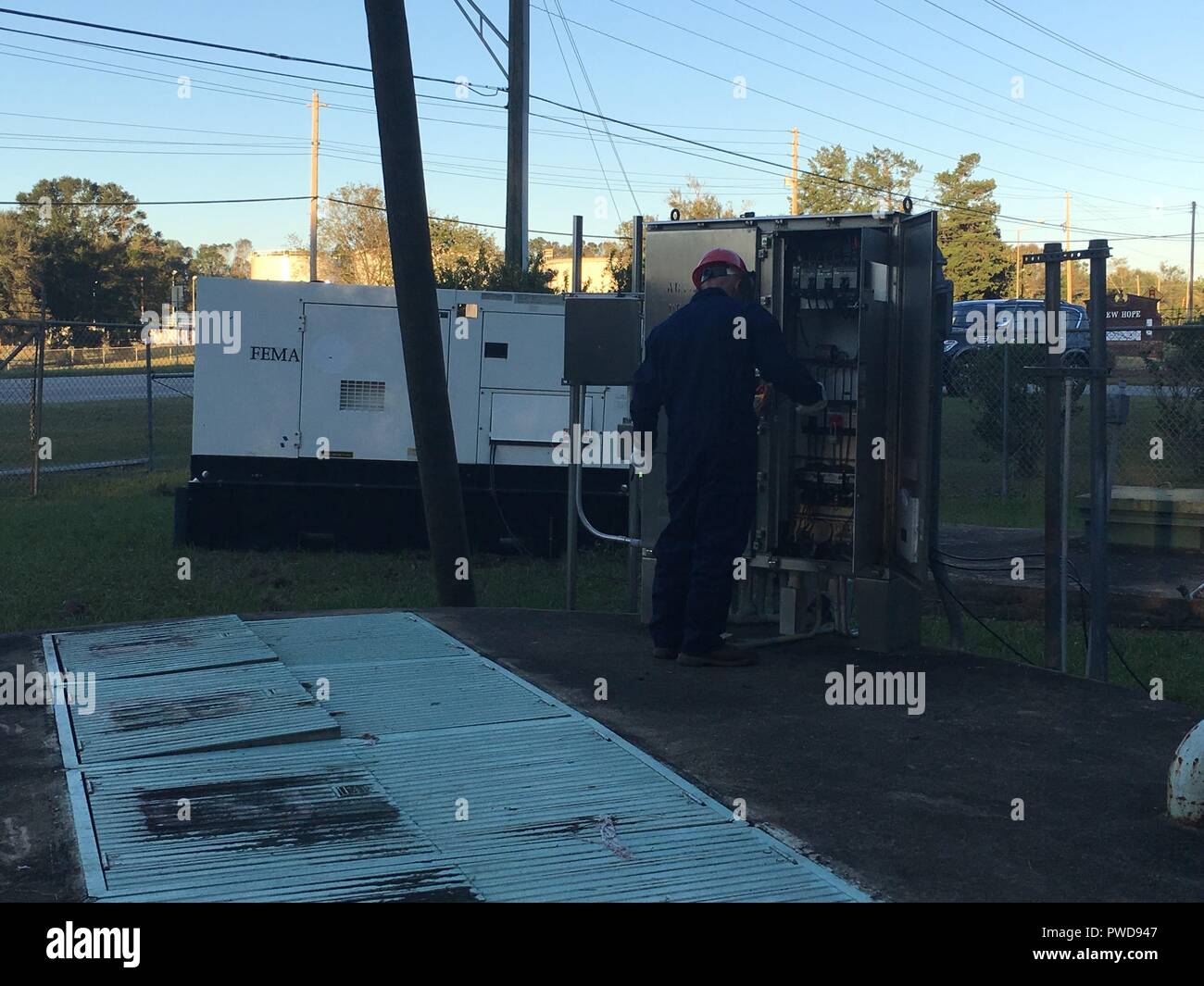 The first emergency generator in USACE's Emergency Power Mission in Georgia was installed last night and is supporting critical wastewater infrastructure in Albany with emergency temporary power while the larger commercial grid continues to be restored, October 13, 2018. Shown: Emergency Power Planning and Response Team personnel from the Savannah District oversee the installation. The Emergency Power Mission is being managed by the U.S. Army Corps of Engineers there in support of FEMA Federal Emergency Management Agency as part of the larger federal response to Hurricane Michael. (Photo by Ch Stock Photo