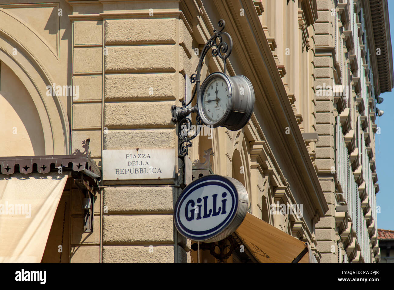 The Piazza della Repubblica sign on the corner of the square next to ...