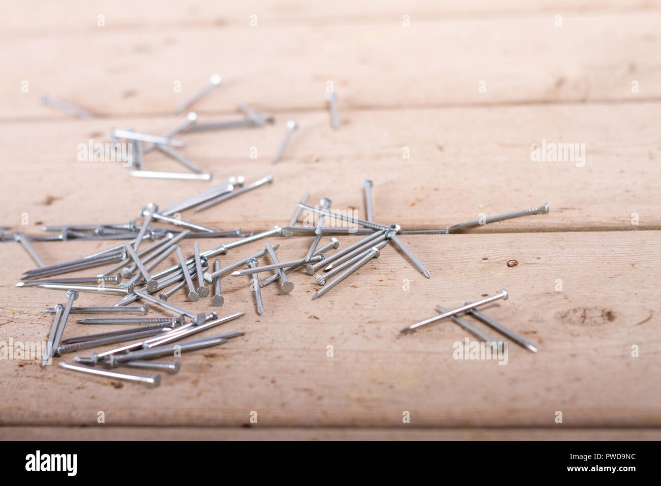 wooden hardware nails on rough surface Stock Photo Alamy