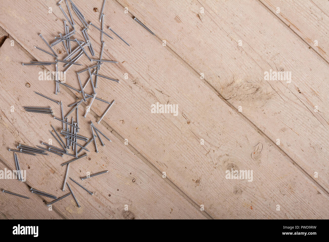 wooden hardware nails on rough surface Stock Photo Alamy