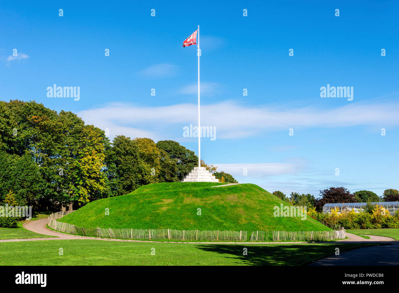 The Mound (artificial hill) wiith a tall flagpole in Duthie Park, Aberdeen, Scotland Stock Photo