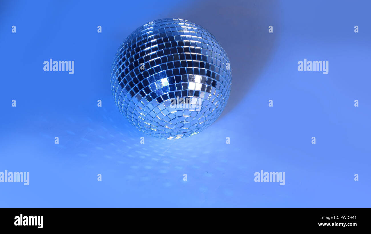 beautiful disco ball on yellow background isolated Stock Photo Alamy