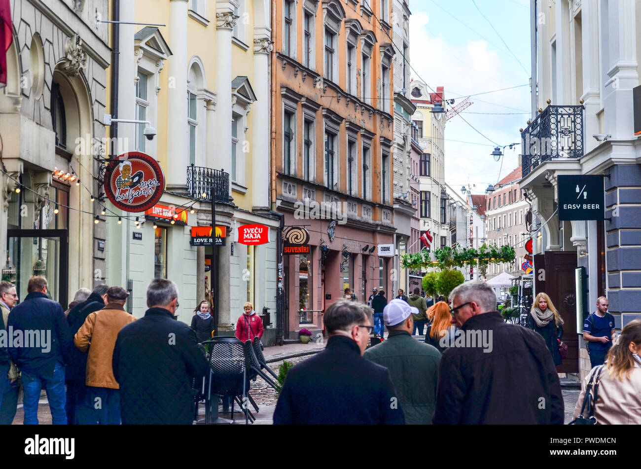 People walking in the streets of the pedestrian old town of Riga, Latvia Stock Photo