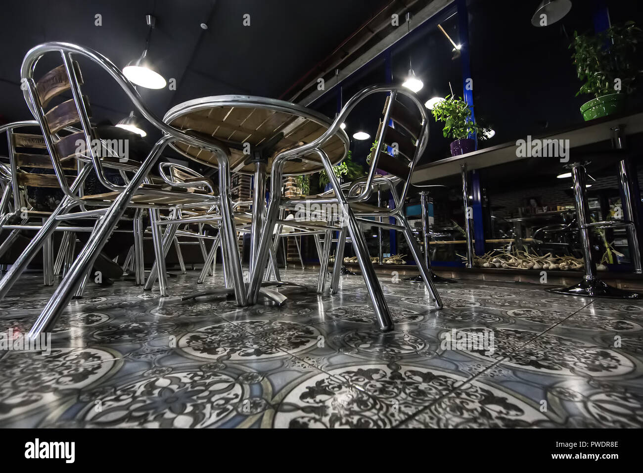 interior cafe with metal chairs and tables Stock Photo - Alamy