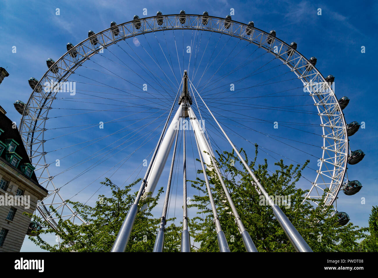 London Eye or Millennium Wheel from below on South Bank of River Thames