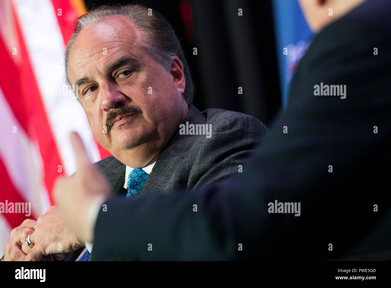 Washington DC, USA. 15th Oct 2018. Larry Merlo, President and CEO of CVS Health, participates in an interview during an Economic Club of Washington event in Washington, D.C., on October 15, 2018. Credit: Kristoffer Tripplaar/Alamy Live News Stock Photo