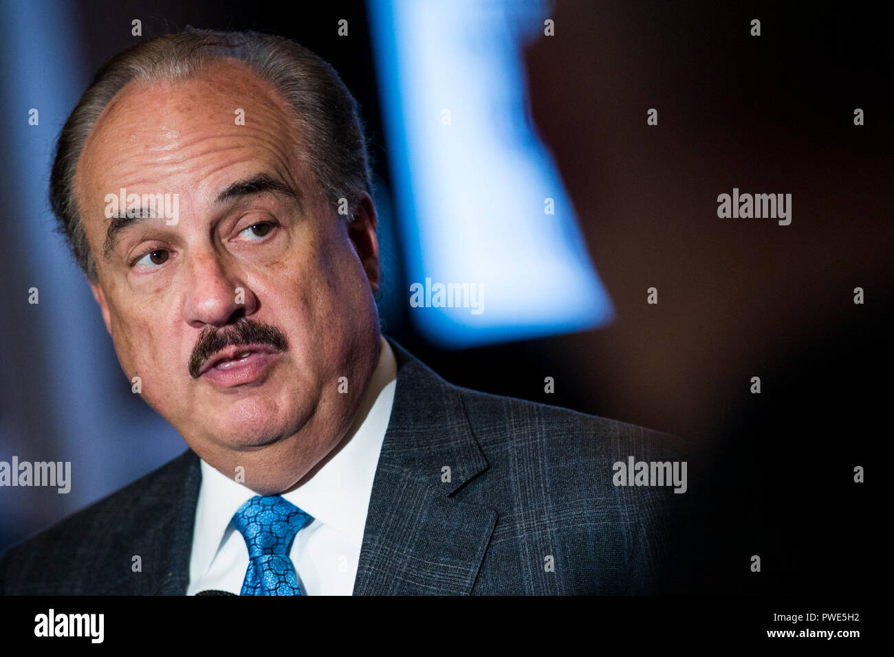 Washington DC, USA. 15th Oct 2018. Larry Merlo, President and CEO of CVS Health, participates in an interview during an Economic Club of Washington event in Washington, D.C., on October 15, 2018. Credit: Kristoffer Tripplaar/Alamy Live News Stock Photo