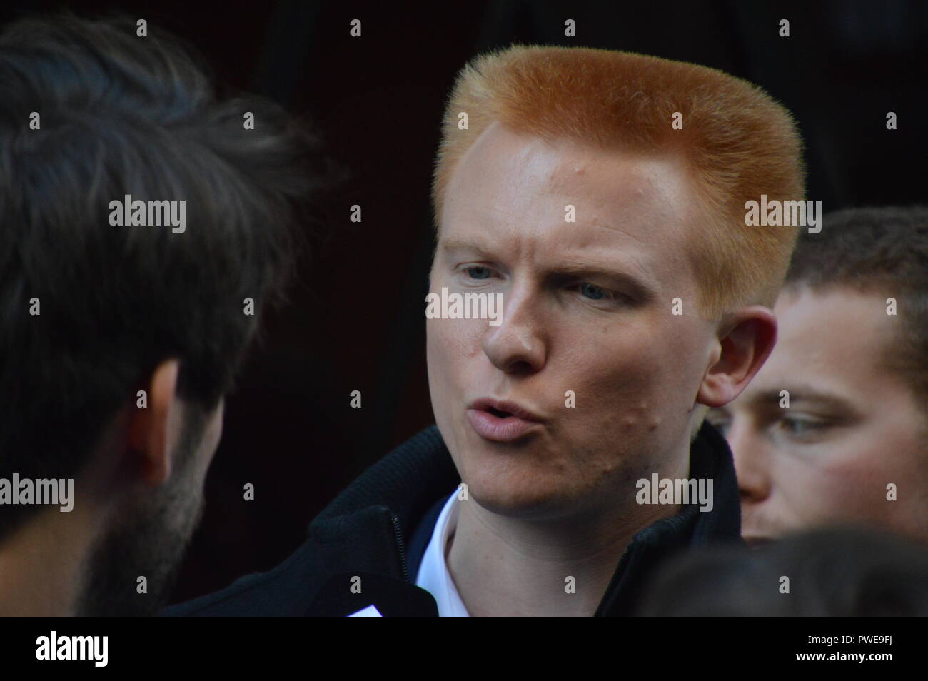 Paris, France. 16th October, 2018. Adrien QUATENNENS (with brushed redhair): French deputy member of LFI. Police search at the french politic party LFI (La France Insoumise : The Unsubmissive France) headquarter. Support is arriving for the founder Jean-Luc Melenchon. 16 october 2018. Paris, France, rue de Dunkerque.  ALPHACIT NEWIM / Alamy Live News Stock Photo