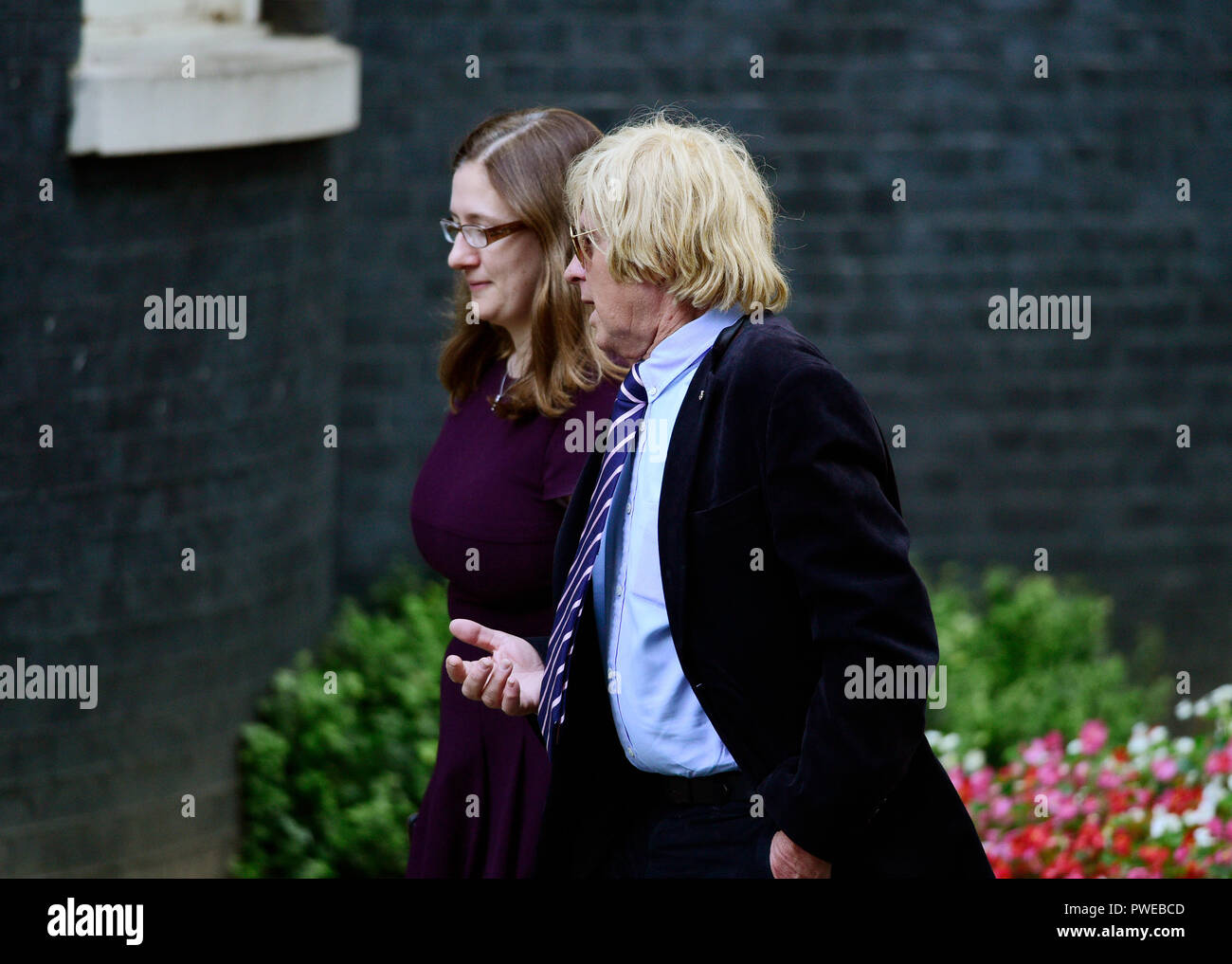 Downing Street, London, UK. 16 October 2018. A steady stream of Conservative MPs and Peers arrive and leave Downing Street for an extended cabinet meeting where Brexit backstop decision is being discussed. Image: MP Michael Fabricant arriving with colleague. Credit: Malcolm Park/Alamy Live News. Stock Photo